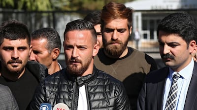 Deniz Naki (C) speaks to the press after the case against him was dropped, in Diyarbakir in 2016. EPA / STR