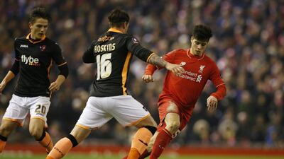 Liverpool’s Joao Carlos Teixeira challenges an Exeter defender during the FA Cup on Wednesday night. Phil Noble / Reuters