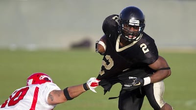 The Abu Dhabi Wildcats, in black, have won both Desert Bowl titles. Christopher Pike / The National