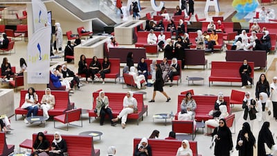 Students sit together at Kuwait University in Kuwait City. AFP