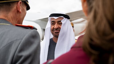 Sheikh Mohamed greets a member of the German delegation
