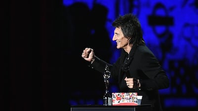The Rolling Stones' Ronnie Wood presents the Best Male Solo Artist award during The BRIT Awards 2020. Getty Images