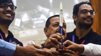 Minister for Science and Technology Jitendra Singh, centre, with a replica of Vikram-S, India's private rocket. The launch vehicle is named Vikram in tribute to the founder of the Indian space programme Vikram Sarabhai. EPA