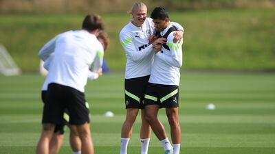 Erling Haaland and Rodri at training. AFP