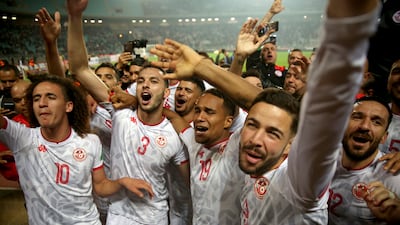 Tunisia players celebrate after beating Mali. AP