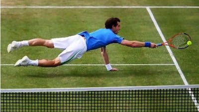 Andy Murray dives for the ball during his men's singles third round match against Janko Tipsarevic.