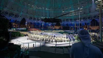 A spectator watches the graduation ceremony.