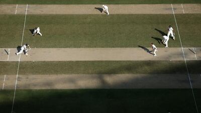 General action shown on the first day of the first Test between Pakistan and Australia in Dubai on Wednesday. Warren Little / Getty Images