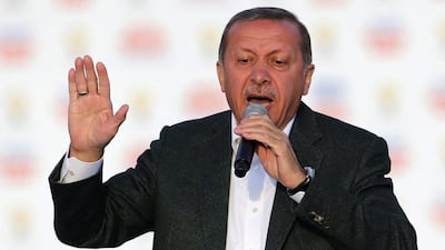 Turkey's prime minister Recep Tayyip Erdogan addresses the crowd during an election rally in Istanbul on March 23. Mr Erdogan rallied hundreds of thousands of supporters, dismissing accusations of intolerance by Western and domestic critics. Murad Sezer / Reuters