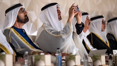 Sheikh Mohamed could be seen taking photos of the event, with Sheikh Mohammed bin Rashid, Sheikh Mansour and Sheikh Saud bin Rashid