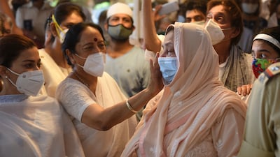 Saira Banu, wife of Indian actor Dilip Kumar, is consoled during the funeral of her husband in Mumbai on July 7, 2021.