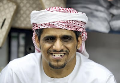 Hasson Omar manages Salmin Trading Shops, which for decades has supplied the emirate's residents with the white ihram cloth worn by men during Hajj. Chris Whiteoak / The National