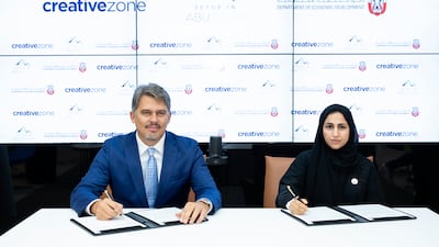 Added's SME sector chief Mouza Al Nasiri, right, and Creative Zone chief executive Lorenzo Jooris during the signing ceremony. Photo: Added