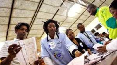 Elections officers sort and count ballots on Wednesday in Durban.