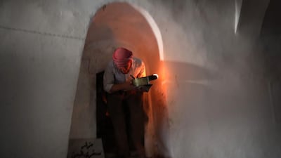 An Iraqi Yezidi visits the Temple of Lalish, in a valley near the Kurdish city of Dohuk about 430km northwest of the capital Baghdad, on July 16, 2019. AFP