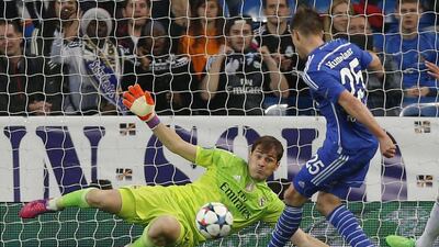Schalke's Klaas-Jan Huntelaar scores past Real Madrid keeper Iker Casillas to make it 2-1 on Tuesday night in their Champions League contest. Daniel Ochoa de Olza / AP