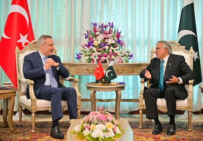 Turkey's Foreign Minister Hakan Fidan, left, and Pakistan's Foreign Minister Ishaq Dar in discussion during the Pakistan-hosted talks with Saudi Arabia, Egypt and Turkey on regional de‑escalation, in Islamabad. Reuters