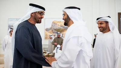 President Sheikh Mohamed greets Dr Omar Habtoor Al Darei, chairman of the General Authority of Islamic Affairs, Endowments and Zakat, and head of the Pilgrims' Affairs Office. Abdulla Al Bedwawi / UAE Presidential Court