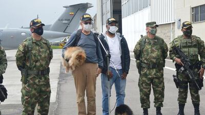 Daniel Guggenheim of Switzerland, left, and Jose Alburqueque of Brazil speak to the media at a military base in Bogota on June 18, 2020 after Colombian forces rescued them from kidnappers. Colombian Army Aviation via Reuters