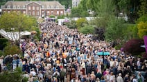 Crowds walk along eastern avenue as they attend the RHS Chelsea Flower Show, at the Royal Hospital Chelsea in London. PA
