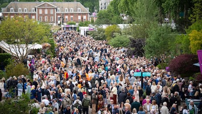 Crowds walk along eastern avenue as they attend the RHS Chelsea Flower Show, at the Royal Hospital Chelsea in London. PA