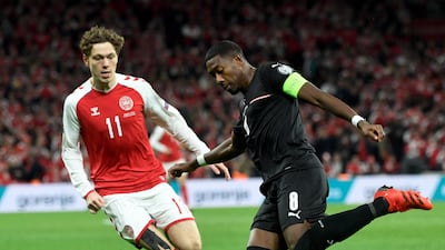 Denmark forward Andreas Skov Olsen closes down Austrian defender David Alaba. AFP