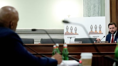 President Biden's FAA pick, left, facing freshman Senator JD Vance at a confirmation hearing. AFP