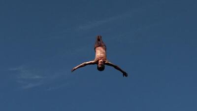 Gary Hunt of the UK competes on his way to winning the Fina High Diving World Cup on the Breakwater along the Corniche in Abu Dhabi on February 29, 2016. Christopher Pike / The National