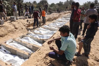 The remains of unidentified Palestinian detainees handed over by Israel are buried at a cemetery in Deir Al Balah, in central Gaza. AFP