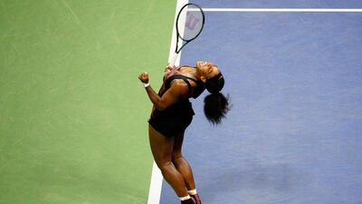 Serena Williams celebrates victory over sister Venus in their quarter-final contest at the US Open on Tuesday in New York City. Alex Goodlett / Getty Images / AFP