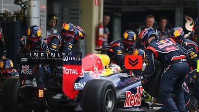 The Red Bull Racing pit crew tend to Sebastian Vettel's car at Interlagos
