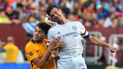 Chelsea’s Cesar Azpilicueta and Barcelona’s Munir El Haddadi vie for the ball in the air during their friendly match on Tuesday in Washington. Nicholas Kamm / AFP