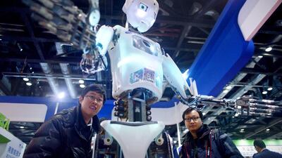 Humanoid robot Xiaoluo, made by domestic company Tami Intelligence, is famous for interacting with people and has hosted galas on television. Wang Zhao / AFP