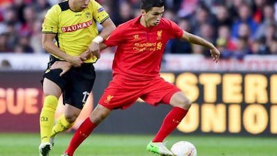 Liverpool's midfielder Nuri Sahin (R) vies for the ball with Young Boys' defender Elsad Zverotic during the Europa League group A football match between Young Boys and Liverpool on September 20, 2012 in Bern. AFP PHOTO / FABRICE COFFRINI