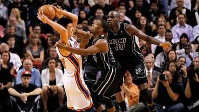 MIAMI, FL - FEBRUARY 23: Norris Cole, of the Miami Heat, guards Jeremy Lin during a game at American Airlines Arena.