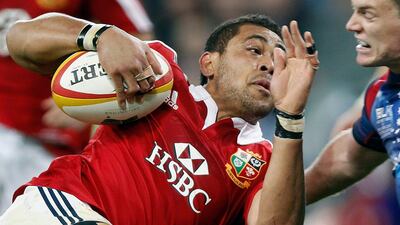 Toby Faletau is tackled by Bryce Hegarty. Brandon Malone / Reuters