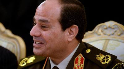 Egyptian army chief Field Marshal Abdel Fattah El Sisi smiles during his meeting with Russian Defence Minster Sergei Shoigu and Foreign Minister Sergei Lavrov in Moscow on February 13. Vasily Maximov / AFP PHOTO