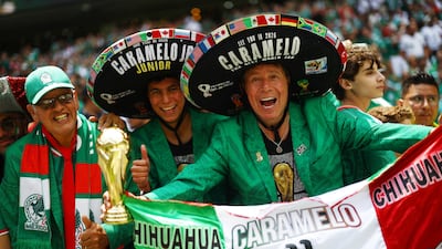 At the Estadio Azteca in Mexico City, fans Caramelo and Caramelo Junior warm up before the match with South Africa. Reuters
