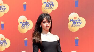Jenna Ortega wearing an off-shoulder Valentino mini dress. AFP