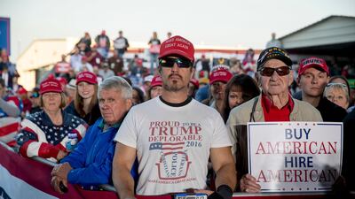 A member of the audience wears a shirt that reads "Proud to Be A Trump Deplorable" as President Donald Trump speaks at a rally at Southern Illinois Airport in Murphysboro, Ill. AP
