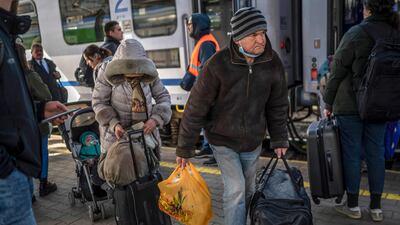 Ukrainian refugees board a train en route to Warsaw at the railway station in Przemysl, near the Polish-Ukrainian border. AFP