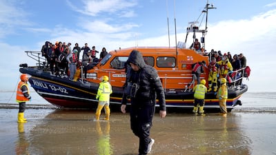 Migrants are taken to Dungeness, Kent, from a small boat in the English Channel on May 17. PA