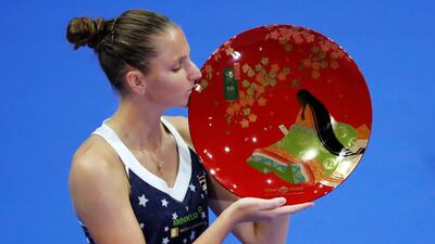 Karolina Pliskova poses with the Tokyo Open trophy after defeating Naomi Osaka in Sunday's final. Reuters
