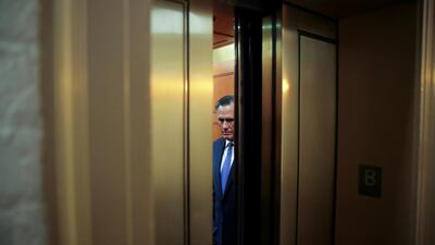 US Senator Mitt Romney rides in a US Capitol elevator to the US Senate floor to cast a guilty vote during the final votes in the Senate impeachment trial of US President Donald Trump. Reuters