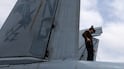 A US sailor on the flight deck of the USS Abraham Lincoln during the conflict with Iran. US Navy / Reuters