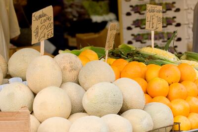 Melons, oranges and sweetcorn on sale at a farmers' market. Stockphoto.com