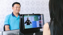 Zhifei Maggie Li, ChatSign’s chief executive and co-founder, right, tests the ChatSign technology. Photo: NYU Abu Dhabi