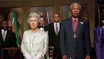 Queen Elizabeth with Nelson Mandela at a banquet in Cape Town, South Africa, in 1995. Getty