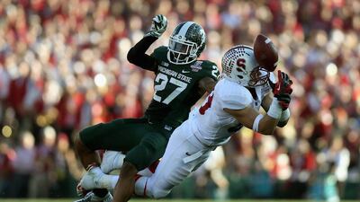 Wide receiver Devon Cajuste, right, of Stanford is unable to make a catch against safety Kurtis Drummond of Michigan State during the 100th Rose Bowl Game at the Rose Bowl on Wednesday in Pasadena, California. Jeff Gross/AFP