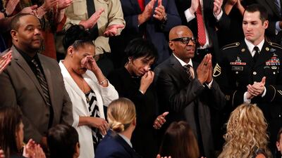 Elizabeth Alvarado, Robert Mickens, Evelyn Rodriguez, and Freddy Cuevas, the parents of two girls who were chased down and brutally murdered by gang members, cry as president Donald Trump introduces them during his State of the Union address. Jonathan Ernst / Reuters
